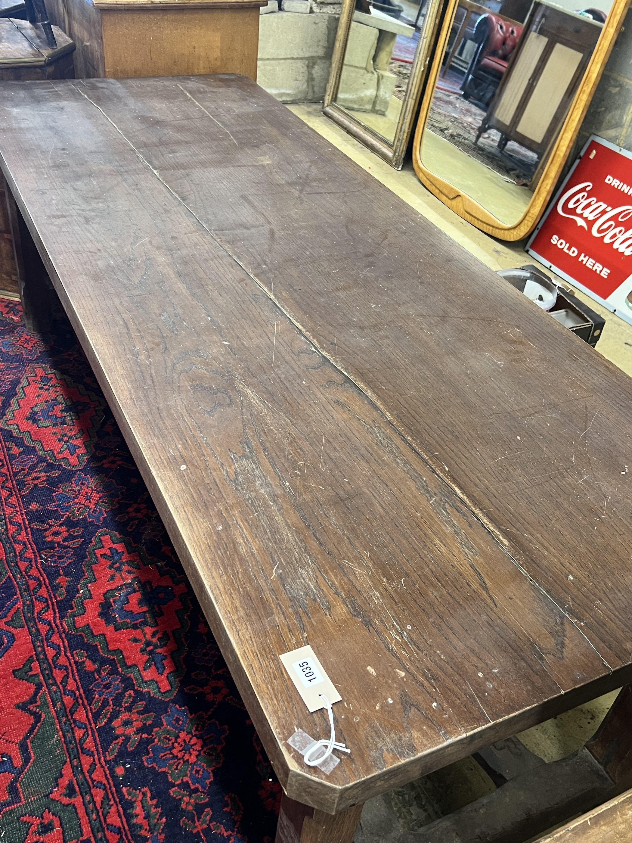 A late 19th century French oak refectory dining table with 'X' stretcher, length 210cm, width 79cm, height 73cm